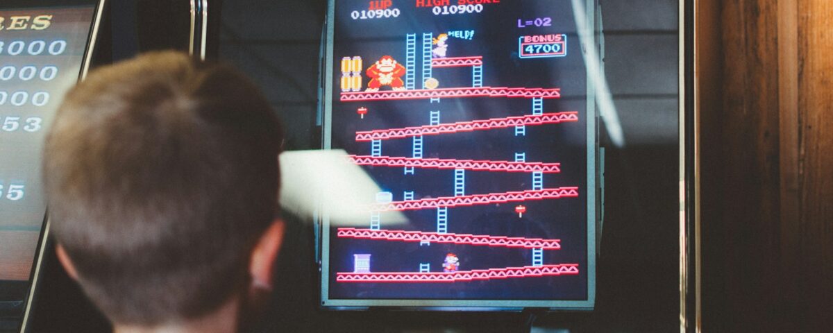 boy playing donkey kong arcade box