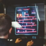 boy playing donkey kong arcade box