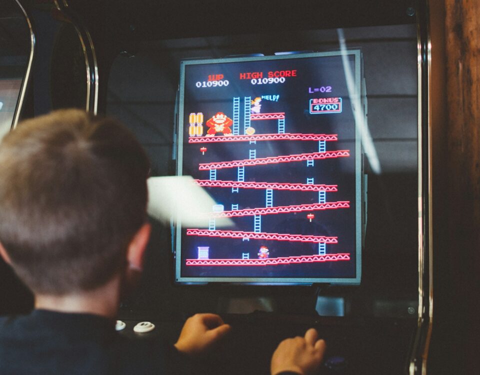 boy playing donkey kong arcade box